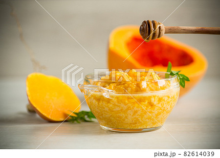 sweet boiled pumpkin porridge in a bowl with honey sweet boiled pumpkin porridge in a bowl with honey 82614039