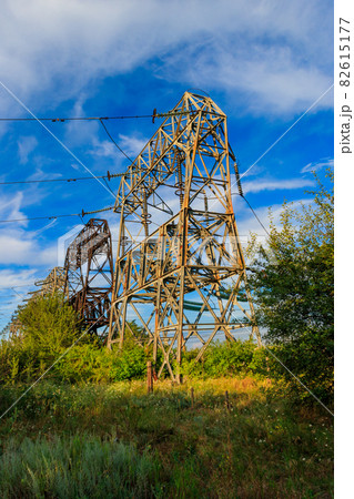 High voltage power line against blue sky 82615177