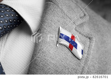 Metal badge with the flag of Netherlands Antilles on a suit lapel 82616701