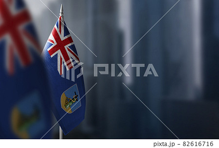 Small flags of Montserrat on a blurry background of the city Small flags of Montserrat on a blurry background of the city 82616716