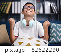 asian boy very excited, passionate, satisfied with something. 82622290