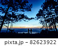 Silhouette couple with a beautifu mountain ridge and sky 82623922