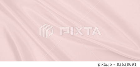 Smooth elegant pink silk or satin texture as wedding background. Luxurious background design Smooth elegant pink silk or satin texture as wedding background. Luxurious background design 82628691