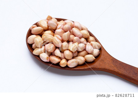 Raw peanuts on white background. Raw peanuts on white background. 82628711