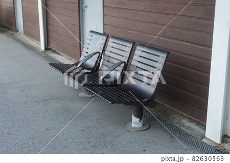 Closeup of modern metallic bench in the train station 82630563