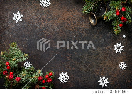 Christmas composition. Christmas tree and decorative ornaments on a dark stone and slate background. Flat lay, top view with copy space. Christmas composition. Christmas tree and decorative ornaments on a dark stone and slate background. Flat lay, top view with copy space. 82630662