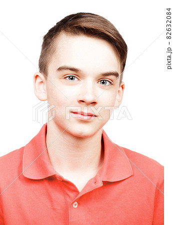 Teen boy wearing living coral trendy color polo shirt portrait isolated on white 82632084