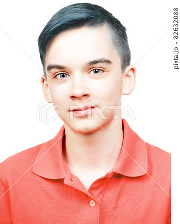 Teen boy wearing living coral trendy color polo shirt portrait isolated on white 82632088