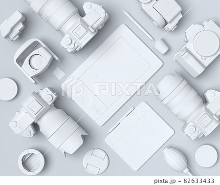 Top view of monochrome designer workspace and photography gear on black table 82633433