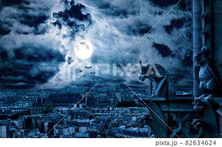 Paris at gothic night on Halloween, France. Fantasy panorama of creepy city and gargoyle . Paris at gothic night on Halloween, France. Fantasy panorama of creepy city and gargoyle . 82634624
