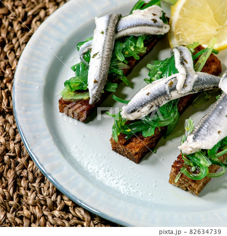 Appetizers tapas pickled anchovies or sardines fillet 82634739