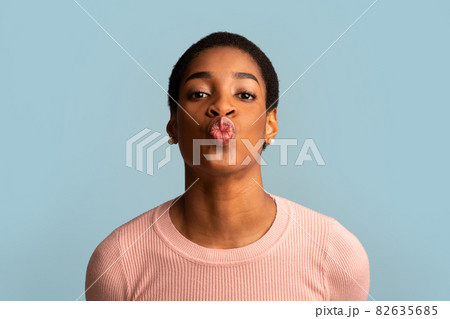 Young Beautiful Black Female Blowing Air Kiss At Camera Young Beautiful Black Female Blowing Air Kiss At Camera 82635685