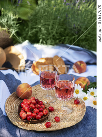 Set for picnic on blanket in lavender field 82637670