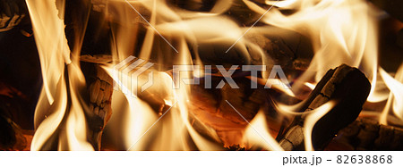 Macro photography of the bonfire in the forest. Burning wood. Summer picnic in the forest. Macro photography of the bonfire in the forest. Burning wood. Summer picnic in the forest. 82638868