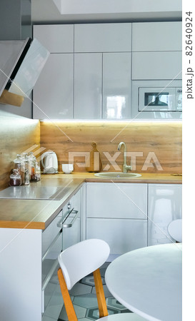 Modern kitchen interior with wooden and white elements, domestic life, home showcase interior concept 82640924