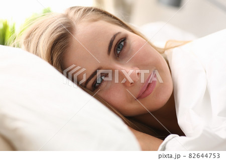 Young beautiful woman waking up in the morning Young beautiful woman waking up in the morning 82644753