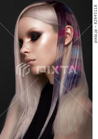 Beautiful girl with multi-colored hair and creative make up and hairstyle. Beauty face. 82645118