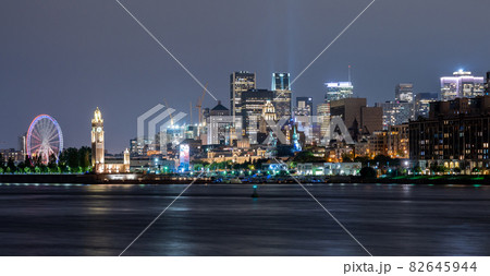 View of downtown Montreal city skyline and Saint Lawrence River at night, Quebec, Canada. 82645944