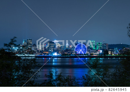 View of downtown Montreal city skyline and Saint Lawrence River at night, Quebec, Canada. 82645945