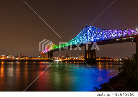 Jacques Cartier Bridge in a rainbow lighting at night. Montreal, Quebec, Canada. Jacques Cartier Bridge in a rainbow lighting at night. Montreal, Quebec, Canada. 82645960