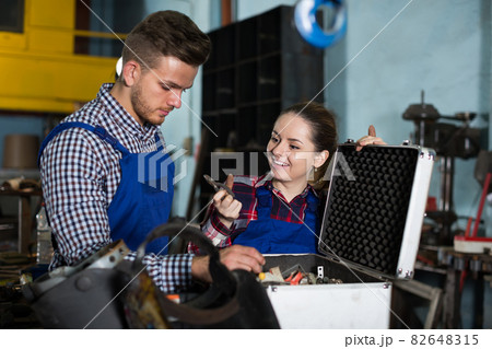 Man with female are looking instruments Man with female are looking instruments 82648315