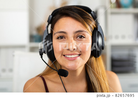 Portrait of woman helpline operator Portrait of woman helpline operator 82657695