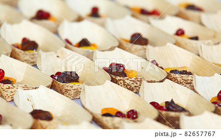 Cooking demonstration, table with food portions on display. 82657767