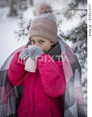 Child in winter. A little girl in the winter outside. 82661047