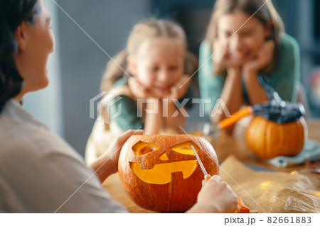 family preparing for Halloween 82661883