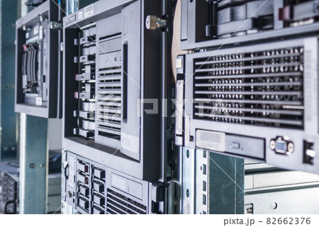 Cluster of data storage hard drives inside server room 82662376