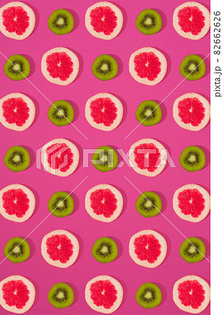Grapefruit and kiwi pattern on pink background. Minimal flat lay concept. 82662626