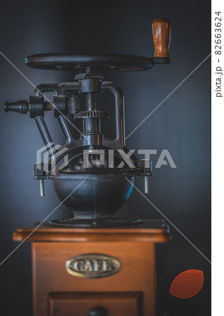 Vintage old coffee grinder with on dark background. Vintage old coffee grinder with on dark background. 82663624