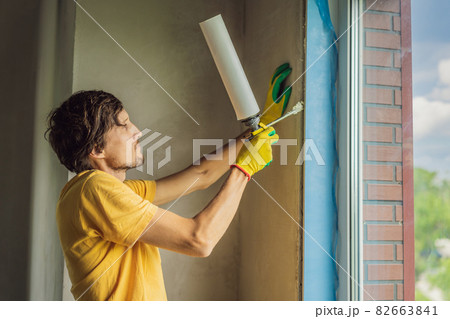Builder or handyman is engaged in the repair or installation of windows 82663841