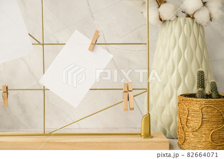 Cards and posters mock ups on grid board. Copy space. Feminine hipster office table decoration. Home office desktop. Freelance bloggers workplace 82664071