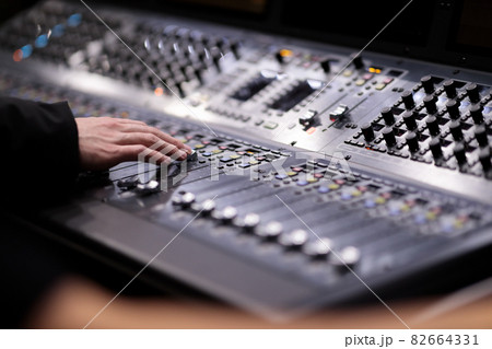 sound engineer working with audio mixing console 82664331
