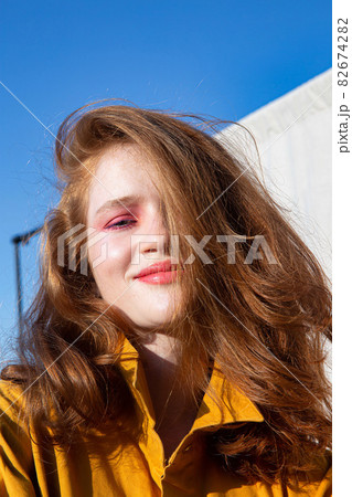 Girl with bright makeup with sky Girl with bright makeup with sky 82674282