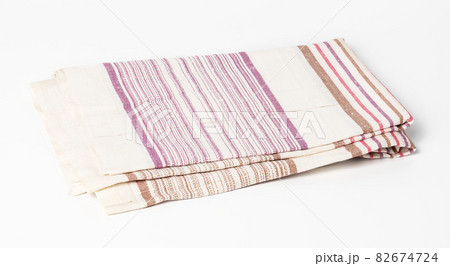 folded white linen towel on white background, top view 82674724