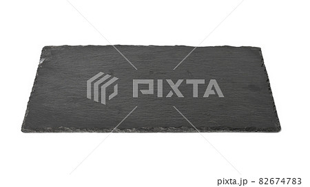 big rectangular black slate stone board isolated on white background, utensils for serving food big rectangular black slate stone board isolated on white background, utensils for serving food 82674783