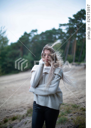 Woman in forest with trees behind 82675897