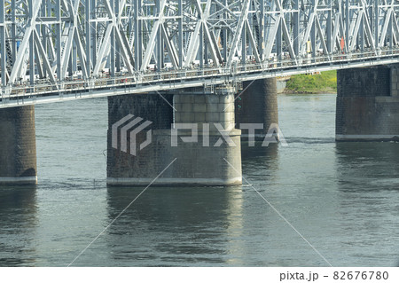 Massive pillars of a railway bridge with a columnar superstructure. 82676780
