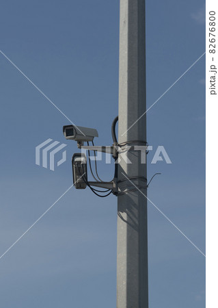 CCTV cameras on a high pillar at the edge of a road bridge. CCTV cameras on a high pillar at the edge of a road bridge. 82676800
