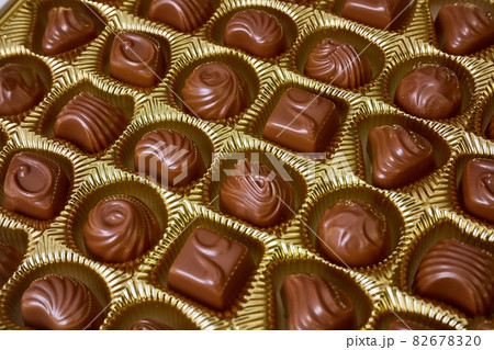 Open box of chocolate treets Open box of chocolate treets 82678320