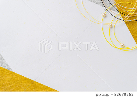 寅のイメージカラーの水引と金銀の千代紙の和風背景 年賀状 寅のイメージカラーの水引と金銀の千代紙の和風背景 年賀状 82679565