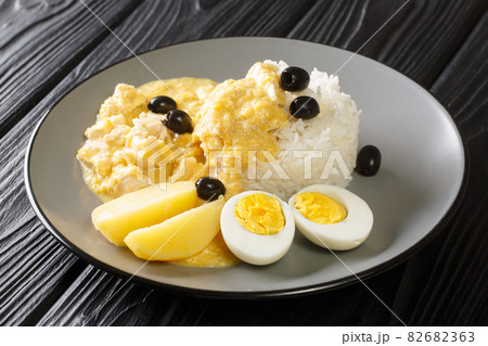 Peruvian made with peppers, chicken, parmesan and a cream sauce with rice in the plate. Horizontal 82682363