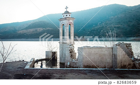 Ruined old church in Alassa, Cyprus is submerged under the water of Kouris dam Ruined old church in Alassa, Cyprus is submerged under the water of Kouris dam 82683659