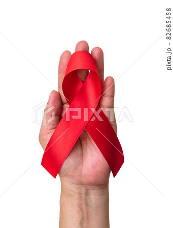World aids day and national HIV AIDS and ageing awareness month with red ribbon on helping hand (isolated with clipping path on white background) World aids day and national HIV AIDS and ageing awareness month with red ribbon on helping hand (isolated with clipping path on white background) 82685458