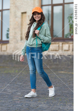 Fashionable fall style. Happy child in casual style outdoors Fashionable fall style. Happy child in casual style outdoors 82686301