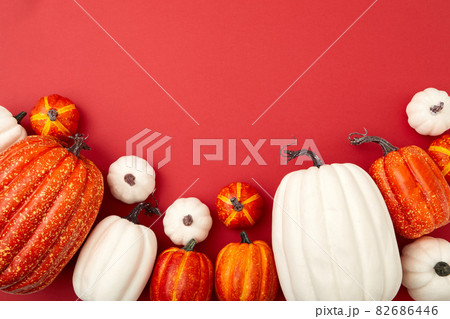 Different sizes of white and orange flatlay 82686446