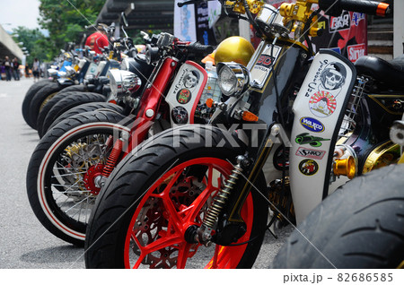 NEGERI SEMBILAN, MALAYSIA -MAY 21, 2016: Group of custom street cub motorcycle parked in public areas. Motorcycles were modified by the owner with his creativity. NEGERI SEMBILAN, MALAYSIA -MAY 21, 2016: Group of custom street cub motorcycle parked in public areas. Motorcycles were modified by the owner with his creativity. 82686585
