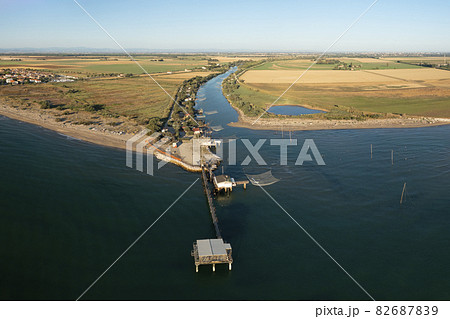 Amazing Drone shot of fishing huts in adriatic coast Amazing Drone shot of fishing huts in adriatic coast 82687839